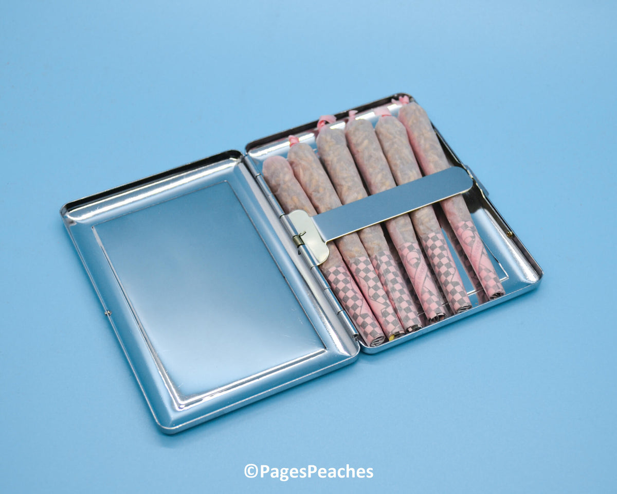 a metal box filled with lots of pink and white crackers